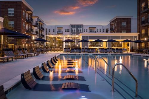 Apartment Rentals in Chattanooga, TN - Pool-with-Tanning-Shelf-and-Patio-Area-at-Dusk