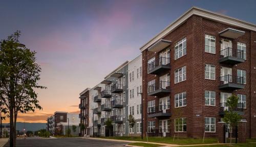 Apartments for rent in Chattanooga, TN - Building-Exterior-at-Dusk-with-View-to-Mountains